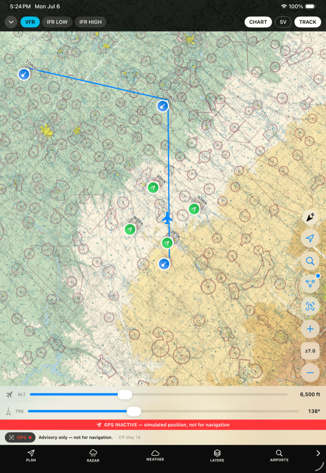 ClearRoute Pilot moving map showing a VFR sectional with a planned route line and the ownship symbol in track-up orientation